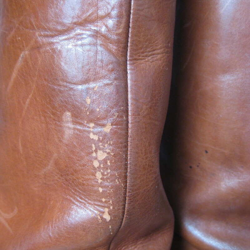 Leather Riding Boots, Brown, Size: 7.5<br />
Beautifully made pair of riding style boots in rich warm tan/brown leather.<br />
These do not have any branding inside or outside.<br />
they have leather outsoles.<br />
They have a thin leather strap detail around the ankles and a low stacked heel.<br />
NO ZIPPERS<br />
Size 7.5<br />
shaft: 15.5  from the top of the arch to the bottom of the heel<br />
width at calf: 6.25<br />
<br />
Good condition, well cared for with signs of use on the toes shaft and bottoms.<br />
Thanks for looking.<br />
#82954