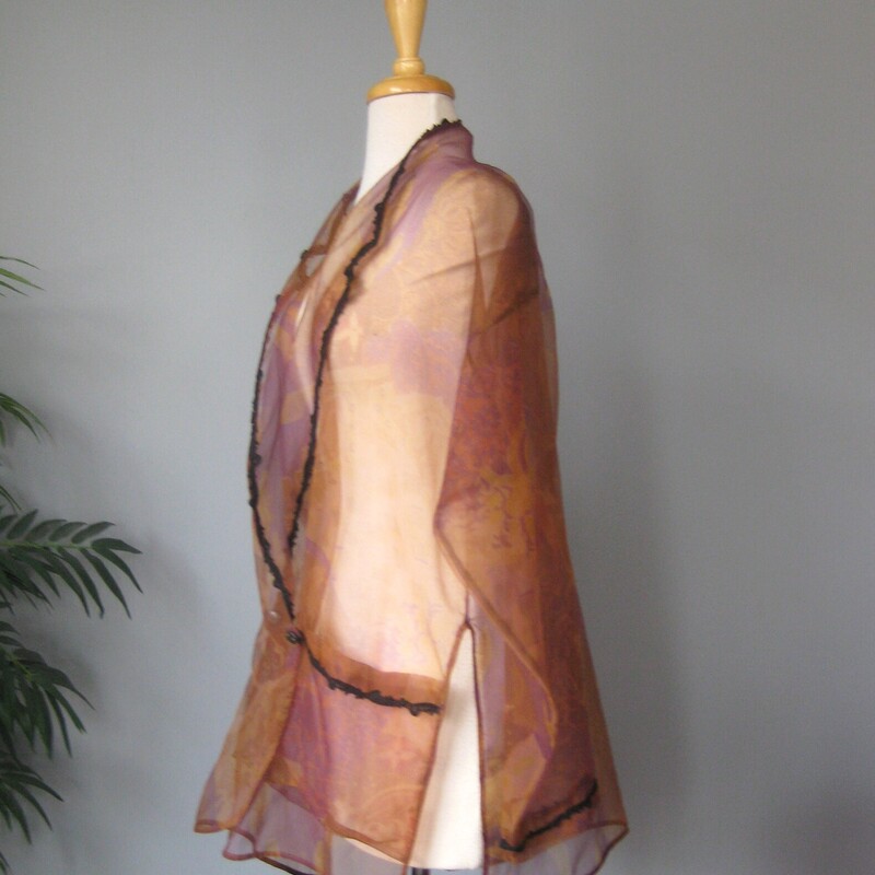 Bryan Emerson Elegant Shr, Brown, Size: One Size<br />
This glamorous garment is quite versatile.<br />
It can serve as an evening wrap.<br />
It can switch an daytime outfit up to an evening look<br />
It could also serve as a coverup at the pool or the beach, throw this on before you head up to lunch.<br />
It doesn't have any fabric id tag, it's a non stretch gauze.<br />
completely Sheer<br />
it has two pockets<br />
the edges are trimmed with black braid<br />
It has two fancy and sparkly buttons<br />
No size tag, should fit anyone!<br />
Flat measurements:<br />
shoulder to shoulder: 21.5<br />
armpit to armpit: 23.5<br />
width at hem 23<br />
length: 34<br />
<br />
excellent condition,<br />
thanks for looking!<br />
#76952