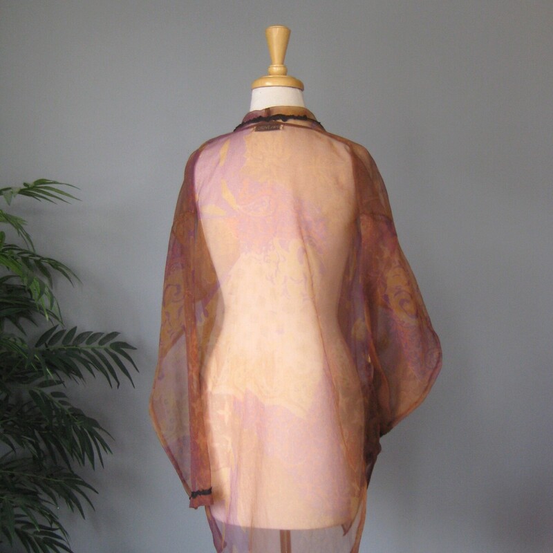 Bryan Emerson Elegant Shr, Brown, Size: One Size<br />
This glamorous garment is quite versatile.<br />
It can serve as an evening wrap.<br />
It can switch an daytime outfit up to an evening look<br />
It could also serve as a coverup at the pool or the beach, throw this on before you head up to lunch.<br />
It doesn't have any fabric id tag, it's a non stretch gauze.<br />
completely Sheer<br />
it has two pockets<br />
the edges are trimmed with black braid<br />
It has two fancy and sparkly buttons<br />
No size tag, should fit anyone!<br />
Flat measurements:<br />
shoulder to shoulder: 21.5<br />
armpit to armpit: 23.5<br />
width at hem 23<br />
length: 34<br />
<br />
excellent condition,<br />
thanks for looking!<br />
#76952