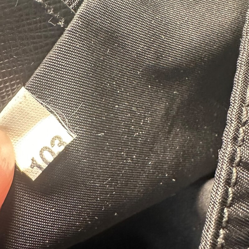 Prada Nylon Zip Messenger<br />
<br />
Factory Code: 103<br />
<br />
Dimensions: 9L x8H<br />
<br />
Very good condition. Minor marks on nylon.<br />
<br />
Does not come with original box or dust bag.