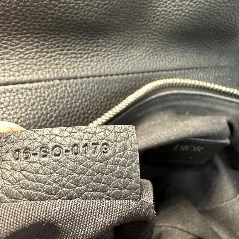 Dior Saddle Messenger<br />
 Saddle Bag<br />
Grained Leather<br />
<br />
Date Code: 05-BO-0179<br />
<br />
Dimensions:<br />
10.5in L  x 8 in H x 2in W<br />
<br />
Very good condition. Some minor scratches on hardware.<br />
<br />
Does not come with original dust bag or box.