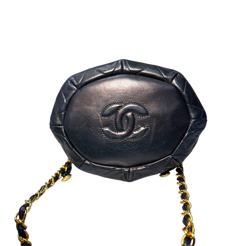 Chanel Crossbody Drawstring Bucket<br />
Quilted Lambskin<br />
<br />
Color: Navy<br />
<br />
Serial Number: 0819022<br />
<br />
Dimensions:<br />
L 6.5in  x W 5in x 7in H<br />
20in handle drop<br />
<br />
Very Good condition.<br />
Good condition. Normal creasing due to style and minor corner wear.<br />
<br />
Does not come with the original dust bag or box.