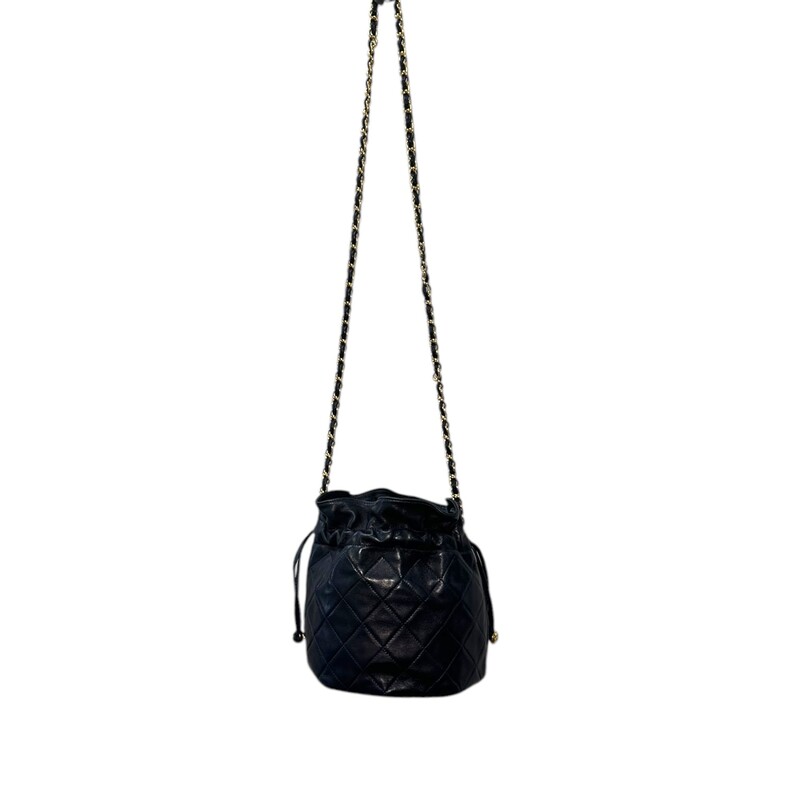 Chanel Crossbody Drawstring Bucket<br />
Quilted Lambskin<br />
<br />
Color: Navy<br />
<br />
Serial Number: 0819022<br />
<br />
Dimensions:<br />
L 6.5in  x W 5in x 7in H<br />
20in handle drop<br />
<br />
Very Good condition.<br />
Good condition. Normal creasing due to style and minor corner wear.<br />
<br />
Does not come with the original dust bag or box.