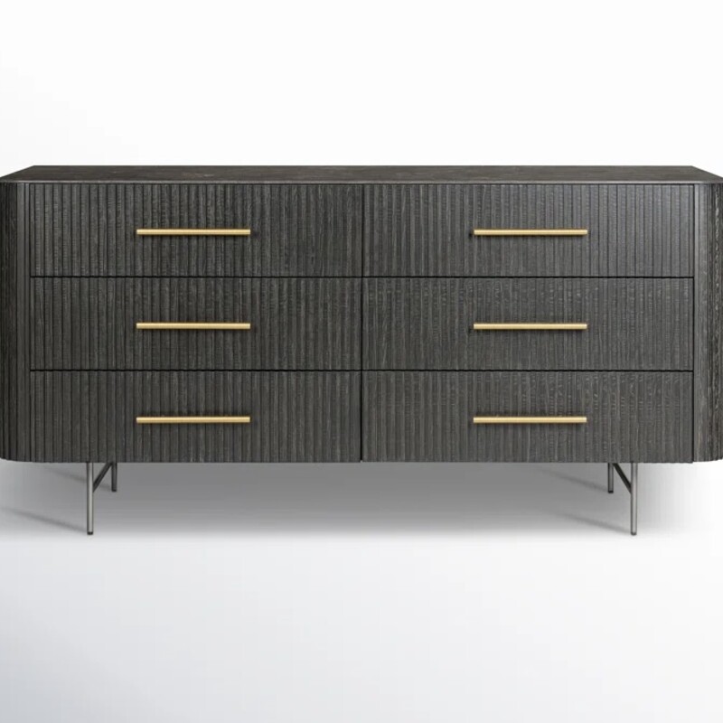 Four Hands Toriano<br />
<br />
Size: 65Wx23Dx32H<br />
<br />
Rich with reeding for great texture and a linear look, black-finished solid oak flaunts six spacious drawers with polished brass hardware and coolly curved corners, while a bluestone top brings a beautifully complementary material mix to bedroom storage. White mineral lines and subtle color, texture and pattern variations are to be expected and speak to each stone's individual nature.