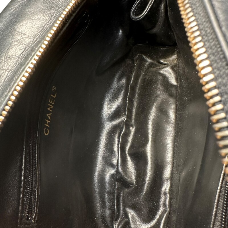 Chanel Camera Lambskin Black Handbag<br />
<br />
Entrupy Certificate provided<br />
<br />
Dimensions:<br />
9in x 6.5in x2in<br />
<br />
In very good condition. Tarnishing to the hardware. Light wear to the lambskin throughout the bag. Zipper pull on one interior pocket missing.<br />
<br />
Does not come with the original dust bag or box.