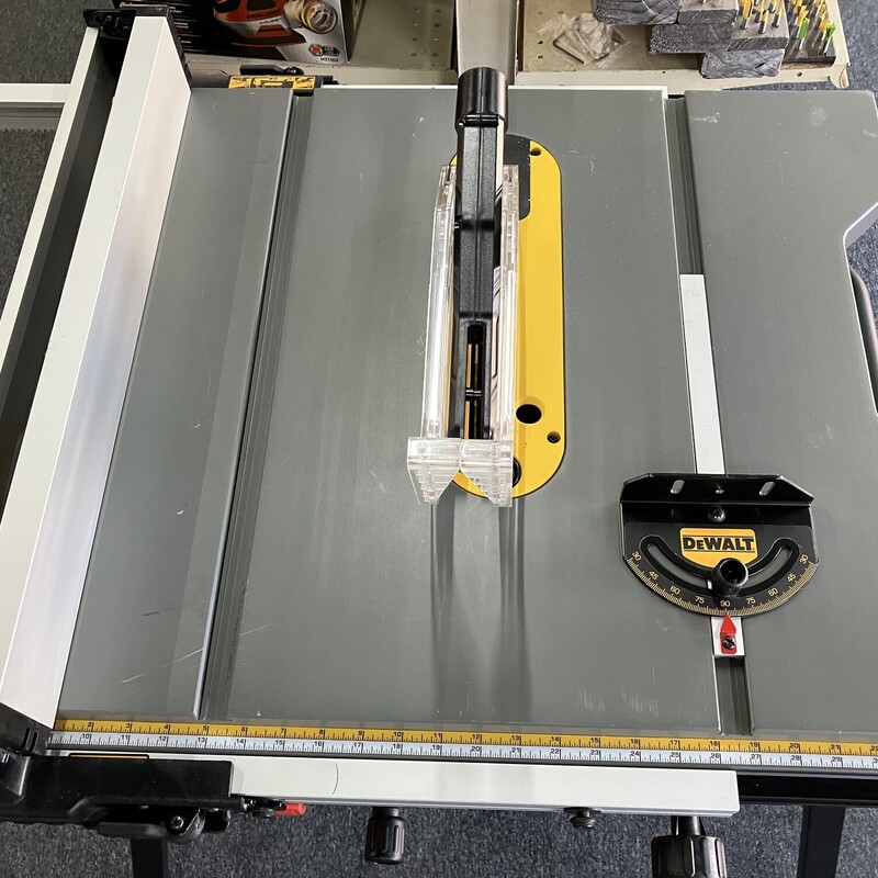 Table Saw, DeWalt,  15 Amp Corded 10 in. Job Site Table Saw with Rolling Stand<br />
<br />
Like New Condition<br />
<br />
About This Product<br />
The DEWALT DWE7491RS offers you greater mobility by pairing a DEWALT table saw with a rolling stand. This 10 in. jobsite table saw is powered by a 15 Amp motor with a 32-1/2 in. rip capacity that lets you cut larger shelving, trim boards, and hardwoods with ease. A rack and pinion fence system makes fence adjustments fast, smooth and accurate. The rolling table saw stand is designed for easy set up and break down with excellent stability.<br />
<br />
Highlights<br />
Patented material support, can be used for narrow rip cuts<br />
32-1/2 in. rip capacity easily cuts a variety of larger shelving and trims materials<br />
Push button release design eliminates air blow back when connecting and disconnecting<br />
1-handed loading 1/4 in. hex chuck accepts 1 in. bit tips<br />
2 in. dust collection port easily connects to a vacuum for efficient dust extraction<br />
3-1/8 in. depth of cut at 90 degree and 2-1/4 in. at 45 degree<br />
26-1/4 in. x 22 in. table provides superior material support