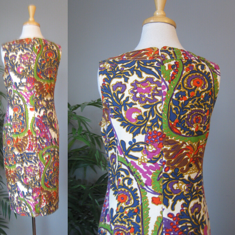 Talbots Tapestry Shift, Multi, Size: 8
This is a sleeveless cotton dress in a colorful paisley print from Talbots
Great for summer.
The outer fashion fabric is 50% cotton and 50% modal (which is a type of rayon), the lining is cotton.
Made in India
Marked size 8 , but no no no!  very slim.  Better for a modern size 4 based on how it fits my mannequin.
Center back zipper
Here are the flat measurements, please double where appropriate, pay especial attention to the hip measurement, that is the limiting factor on this dress:

Armpit to armpit: 17.5
Waist: 16
Hip: 19.25 ( if your hip measurement is 38 around, this will be snug)
Length: 39.25
Excellent condition
Thanks for looking!
#76757