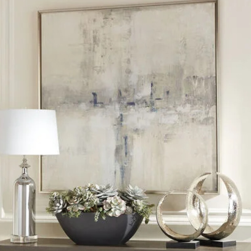 EthanAllen Essence Wall Art
Grey Cream White Navy in Champagne Metal Frame
Size: 44x4x44H
This hand-embellished wall art adds depth and texture to modern style. Blending deep blues, grays, and whites, artist Tim O’Toole creates a transcendent art piece in neutral colors that evoke a sense of natural calm and creativity. It's printed on canvas and embellished by hand with additional paint to enhance its composition and character. Set in a champagne gold frame, this hand-embellished canvas print delivers a sleek, sophisticated style that suits any room.
Retail $1400