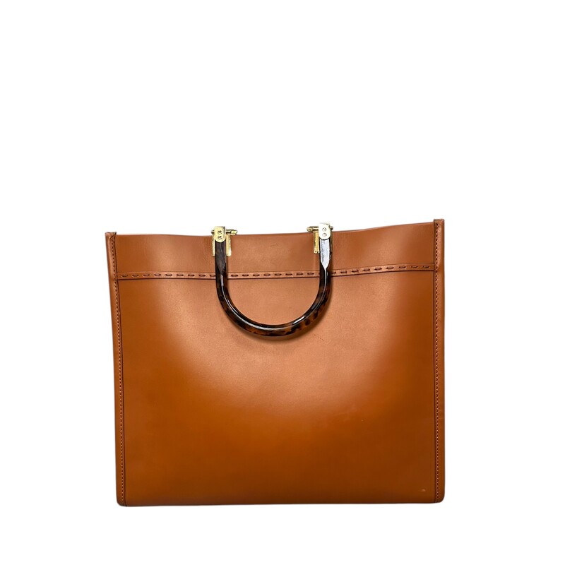 Fendi Sunshine Brown Tote Medium<br />
<br />
Code: 8BH336 ABVL 218 12085<br />
<br />
Dimensions:<br />
Height : 31 cm<br />
Depth : 17 cm<br />
Width : 35 cm<br />
Weight : 1.2 kg<br />
Strap length (min) : 90 cm<br />
Strap length (max) : 90 cm<br />
Shoulder strap drop : 40 cm<br />
<br />
In very good condition. Miner interior wear.<br />
<br />
Comes with original box. No dust bag.