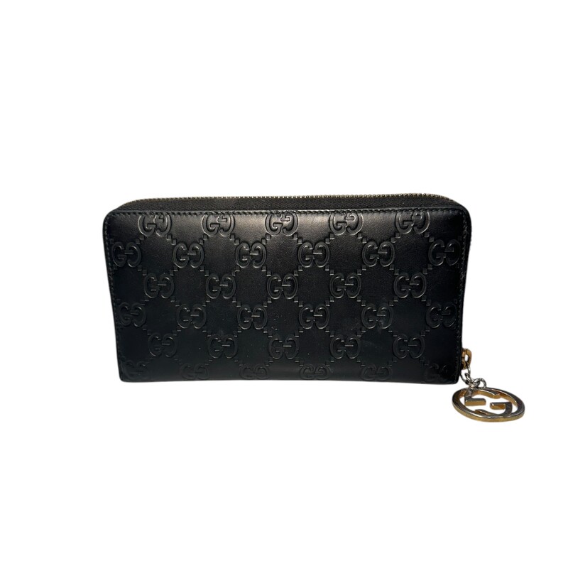 Gucci Eclipse Zip Wallet<br />
Black<br />
 Size: OS<br />
<br />
Code: 409342-493075<br />
<br />
In good condition. Tarnishing on zipper charm.<br />
<br />
Does not come with original dust bag or box.