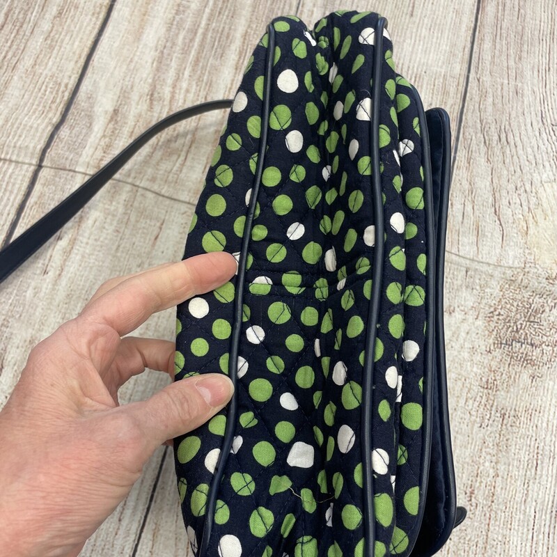 Vera bradley purse/crossbody navy with green white dots. This has a handle on the top also that can be used. Many pockets and compartments to be used.