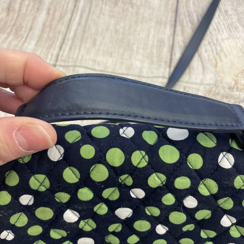 Vera bradley purse/crossbody navy with green white dots. This has a handle on the top also that can be used. Many pockets and compartments to be used.