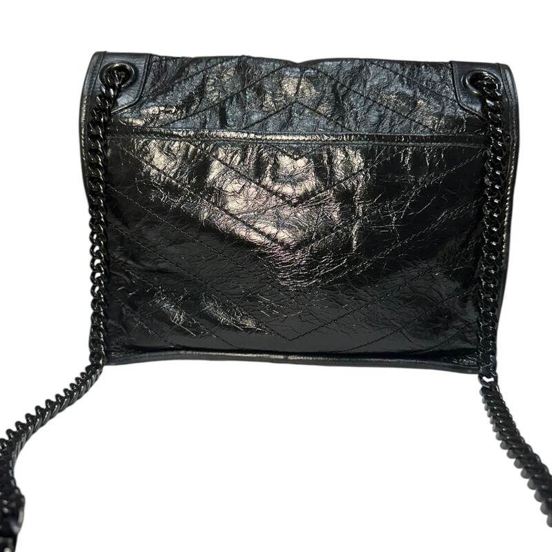 YSL Niki Quilted Crinkled Medium Black Shoulder Bag<br />
<br />
Date Code: YSL633184-0422<br />
<br />
Dimensions:<br />
Min. Strap Length: 63cm / 24.8in<br />
Handle Drop: 29cm / 11.4in<br />
Depth: 10cm / 3.9in<br />
Max. Strap Length: 103cm / 40.6in<br />
Height: 20cm / 7.9in<br />
Width: 28cm / 11in<br />
<br />
In very good condition. Light wear to the corners of the bag.<br />
<br />
Does not come with the original dust bag or box.