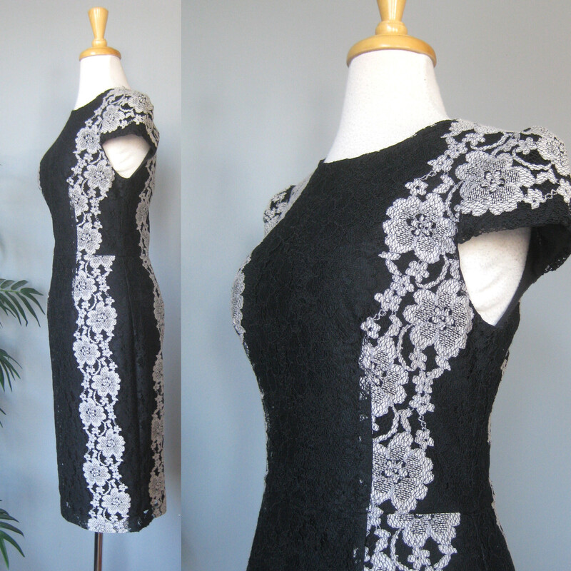 Betsey Johnson Lace Cockt, Black, Size: 6<br />
Stylish body conscious cocktail dress from  Betsey Johnson.<br />
It's made of black and gray lace, arranged in flattering vertical design lines<br />
Cap sleeves fully lined center back zipper<br />
It's marked size 6 BUT, imo opinion it would fit a modern size 4 better.<br />
Please use the flat measurements here as your ultimate guide to how it will fit your body.<br />
The fabric has little to no stretch.<br />
<br />
flat measurements:<br />
shoulder to shoulder: 15<br />
armpit to armpit: 17<br />
waist: 15<br />
hips: 19<br />
length: 40.25<br />
like new condition!<br />
thanks for looking1<br />
#81425