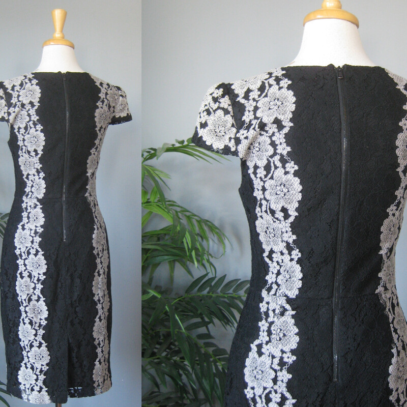 Betsey Johnson Lace Cockt, Black, Size: 6<br />
Stylish body conscious cocktail dress from  Betsey Johnson.<br />
It's made of black and gray lace, arranged in flattering vertical design lines<br />
Cap sleeves fully lined center back zipper<br />
It's marked size 6 BUT, imo opinion it would fit a modern size 4 better.<br />
Please use the flat measurements here as your ultimate guide to how it will fit your body.<br />
The fabric has little to no stretch.<br />
<br />
flat measurements:<br />
shoulder to shoulder: 15<br />
armpit to armpit: 17<br />
waist: 15<br />
hips: 19<br />
length: 40.25<br />
like new condition!<br />
thanks for looking1<br />
#81425