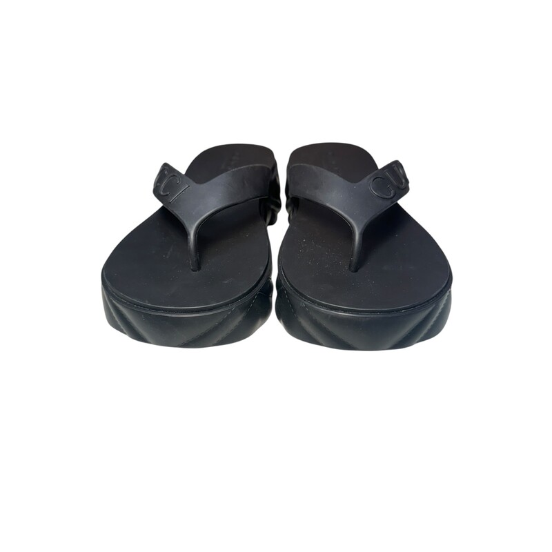 Gucci Debossed Platforms Black Flip Flops<br />
<br />
Size: 37<br />
<br />
Date Code: 746334<br />
<br />
In very good condition. Light marks to the bottom of the shoes.<br />
<br />
Does not come with the original dust bag or box.