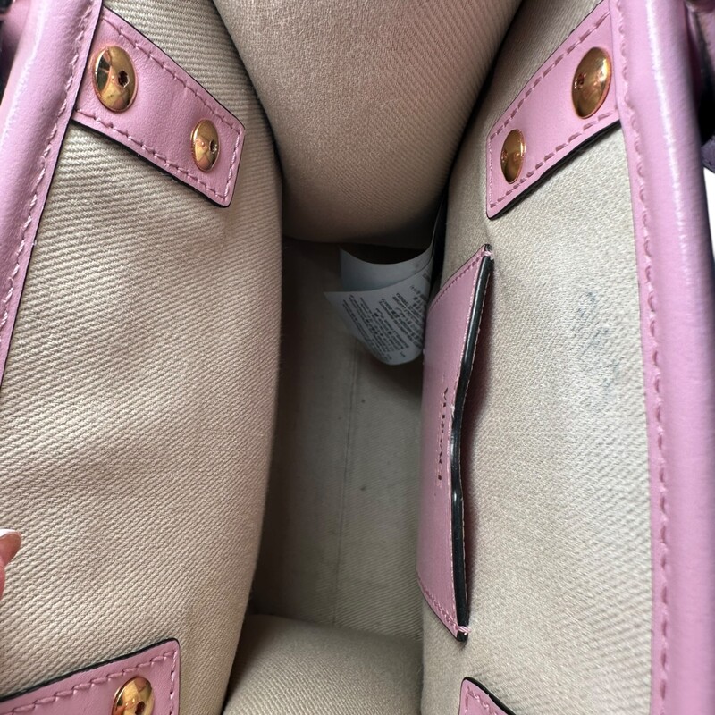 Versace All Over Tote Mini Pink<br />
<br />
Dimensions:<br />
Width:6.7 in<br />
Height:7.5 in<br />
Depth:3.1 in<br />
<br />
In good condition. Small mark by interior pocket.<br />
<br />
Does not come with original dust bag or box.