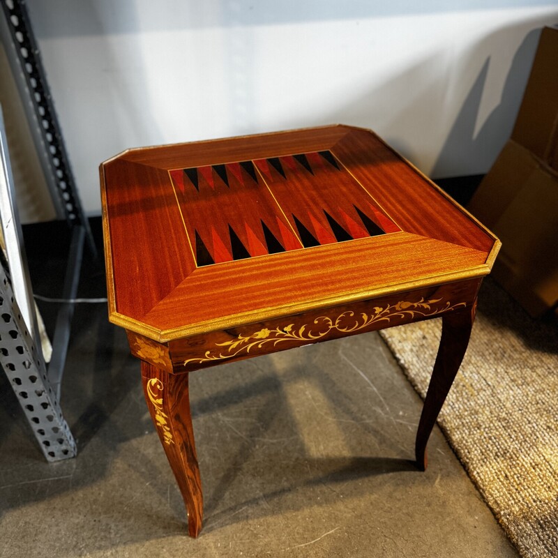Noturno Intarsio Italian Game Table<br />
<br />
Size: 31Lx31Wx30T<br />
<br />
Notturno Intarsio refers to a style of inlaid wood game table, often featuring a variety of games and made in Sorrento Italy. These tables are know for their detailed marquetry and craftnanship. Games include Roulette, Chess, Backgammon and Cards