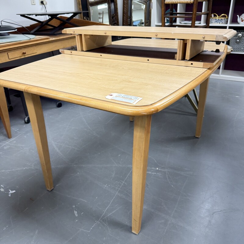 Mid Century Modern Style Maple Dining Table (no chairs included)<br />
Table Size: 57x37<br />
Includes two 12in leaves