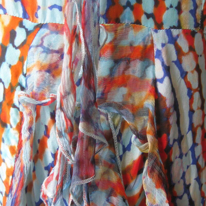 Pretty, feminine, easy to wear and easy to pack 100% silk dress from Sundance.<br />
blue and orange abstract print<br />
squared off v neckline<br />
center back zipper<br />
full skirt<br />
 the silk is gauzy, very lightweight, the dress is lined in cotton.<br />
fluttery ruffles on the skirt<br />
Size 6<br />
flat measurements: no stretch<br />
ampit to armpit: 17.5<br />
waist: 15.5<br />
hip: up to 24<br />
length: 42<br />
<br />
excellent condition, no flaws.<br />
thanks for looking!<br />
#83177