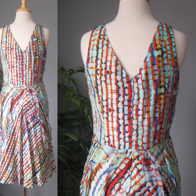 Pretty, feminine, easy to wear and easy to pack 100% silk dress from Sundance.<br />
blue and orange abstract print<br />
squared off v neckline<br />
center back zipper<br />
full skirt<br />
 the silk is gauzy, very lightweight, the dress is lined in cotton.<br />
fluttery ruffles on the skirt<br />
Size 6<br />
flat measurements: no stretch<br />
ampit to armpit: 17.5<br />
waist: 15.5<br />
hip: up to 24<br />
length: 42<br />
<br />
excellent condition, no flaws.<br />
thanks for looking!<br />
#83177