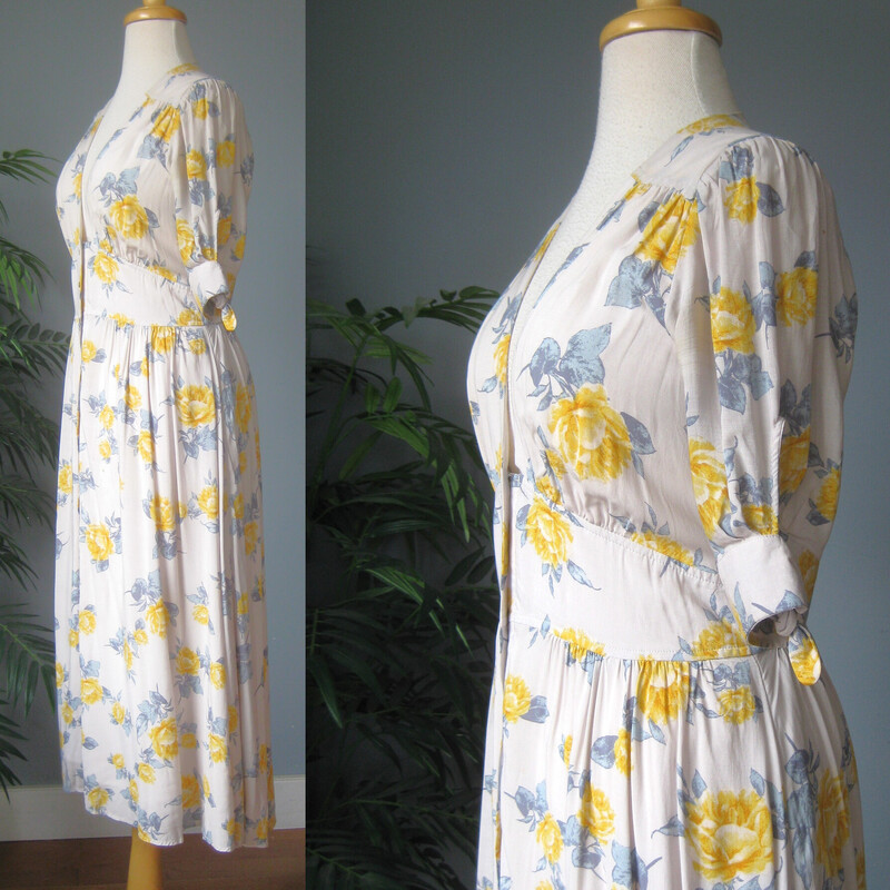 Free People Flowers, Gry/yllw, Size: Small<br />
Pretty, feminine dress from Free People<br />
off white background yellow roses and blue leaves print<br />
Sweet short sleeves with ties<br />
buttons all the way open down the front<br />
blue and orange abstract print<br />
very full lined skirt<br />
<br />
Size S<br />
flat measurements: no stretch<br />
shoulder to shoulder: 14<br />
ampit to armpit: 19<br />
waist: 14.75<br />
hip: up to 21<br />
length: 47<br />
<br />
teeny faint brown spot on the skirt.  kind of disappears in the fullness.<br />
thanks for looking!<br />
#81363