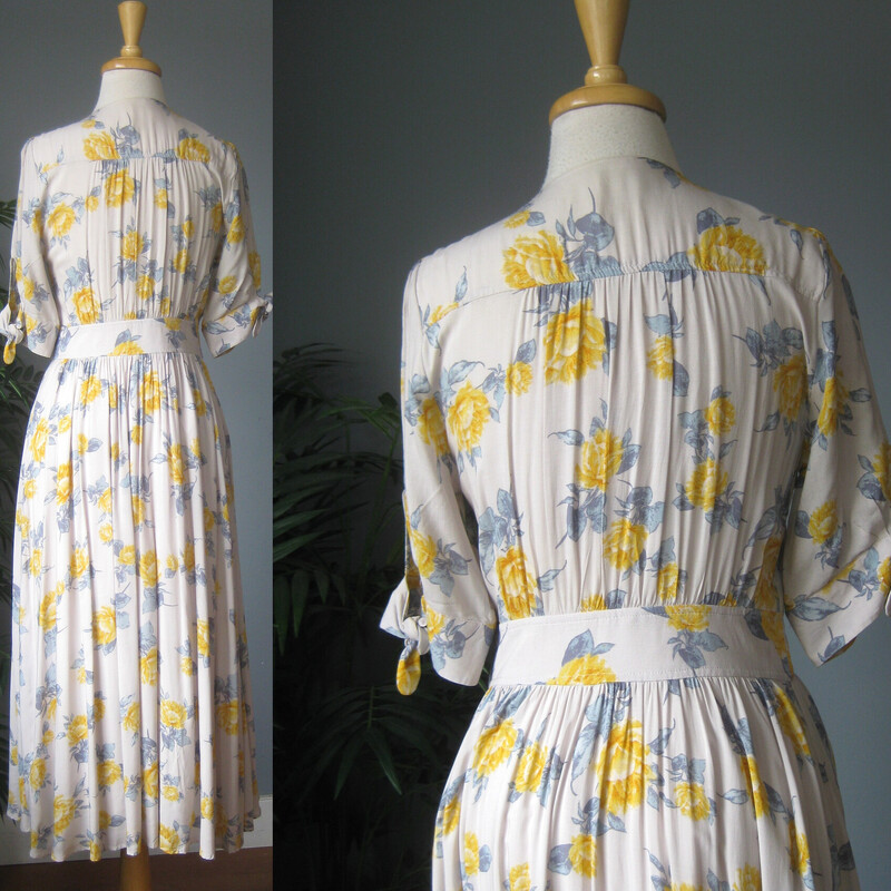 Free People Flowers, Gry/yllw, Size: Small<br />
Pretty, feminine dress from Free People<br />
off white background yellow roses and blue leaves print<br />
Sweet short sleeves with ties<br />
buttons all the way open down the front<br />
blue and orange abstract print<br />
very full lined skirt<br />
<br />
Size S<br />
flat measurements: no stretch<br />
shoulder to shoulder: 14<br />
ampit to armpit: 19<br />
waist: 14.75<br />
hip: up to 21<br />
length: 47<br />
<br />
teeny faint brown spot on the skirt.  kind of disappears in the fullness.<br />
thanks for looking!<br />
#81363