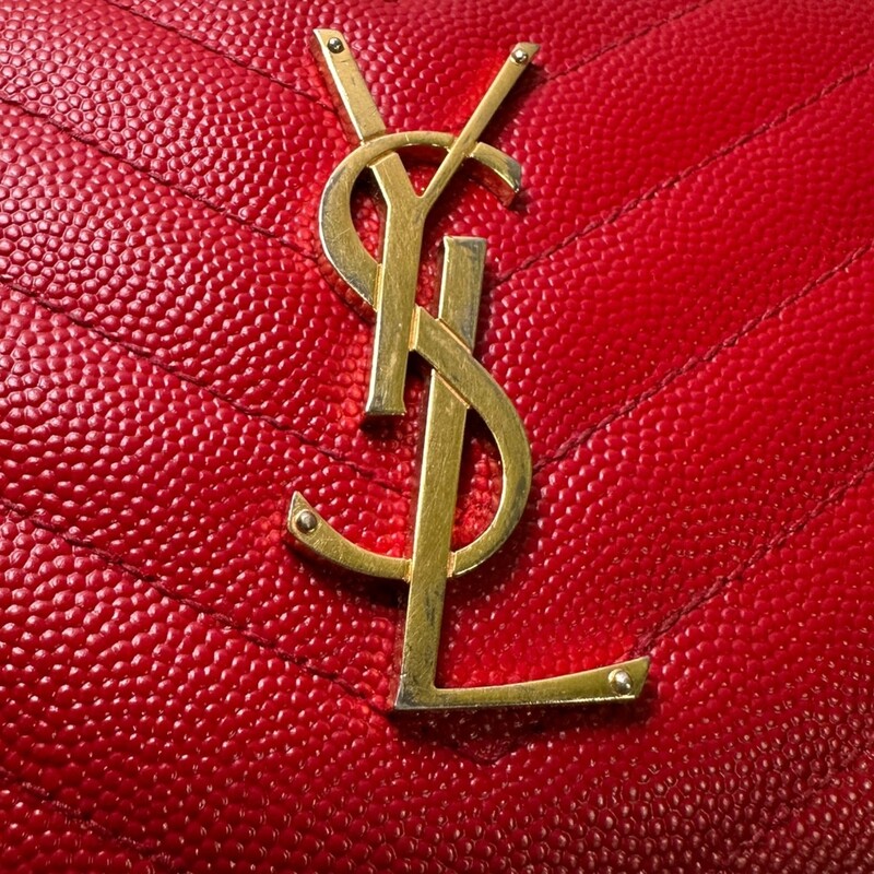YSL Chevron Zip Red Caviar Wallet<br />
<br />
Date Code:<br />
HPP358094 1214<br />
<br />
Dimensions:<br />
Base length: 7.5 in<br />
Height: 3.75 in<br />
Width: 0.75 in<br />
<br />
In very good condition. Significant scratching to the hardware and light tarnishing<br />
<br />
Does not come with the original dust bag or box.