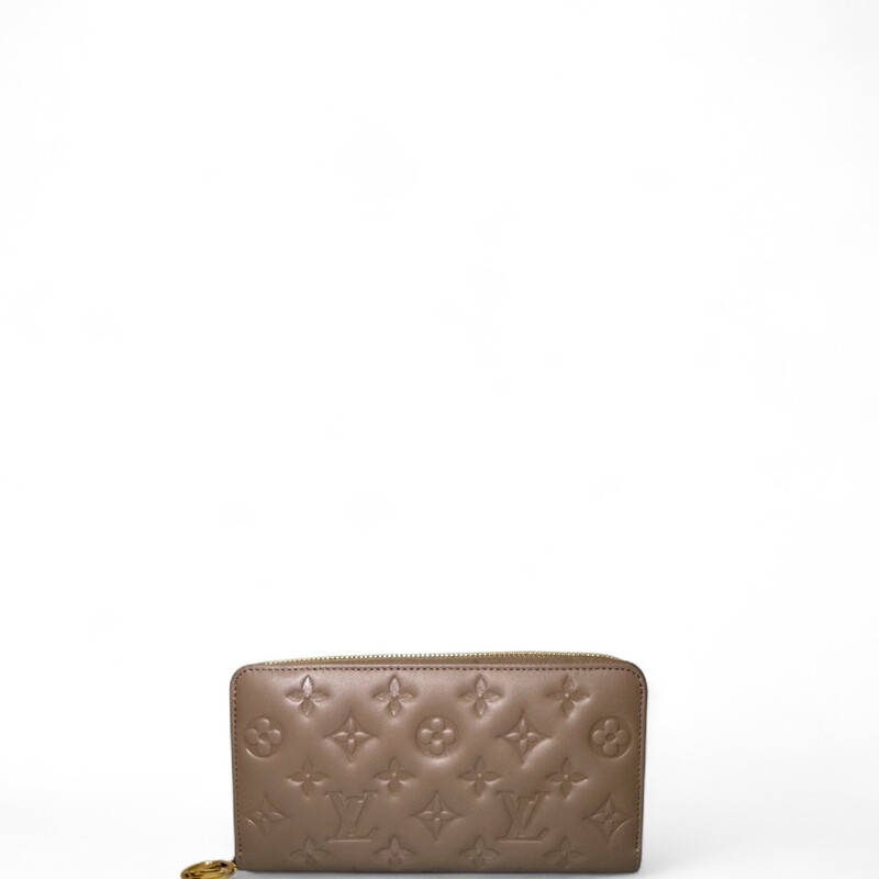 Louis Vuitton Coussin Taupe  Zippy Wallet

Date Code: Microchip

Dimensions:Base length:
7.75 in
Height: 4 in
Width: 0.75 in

In excellent condition.Some minor scratches on hardware.

Does come with original dust bag. No box