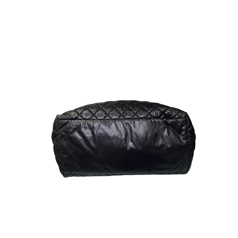 Chanel Cocoon Puff Nylon Tote Black<br />
<br />
Date Code: 2144****<br />
<br />
Dimensions:<br />
Base length: 15 in<br />
Height: 11.5 in<br />
Width: 7 in<br />
Drop: 6.5 in<br />
<br />
In very good condition. Light scratching to the leather. Ripped hole inside front zipper pocket shown in photos.<br />
<br />
Does not come with the original dust bag or box.