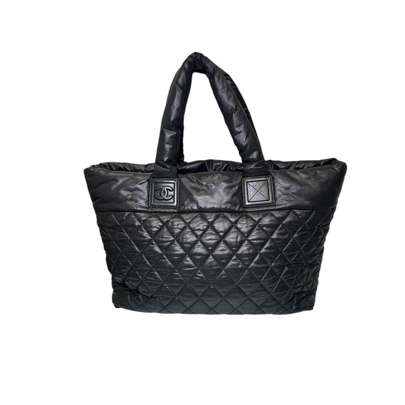 Chanel Cocoon Puff Nylon Tote Black<br />
<br />
Date Code: 2144****<br />
<br />
Dimensions:<br />
Base length: 15 in<br />
Height: 11.5 in<br />
Width: 7 in<br />
Drop: 6.5 in<br />
<br />
In very good condition. Light scratching to the leather. Ripped hole inside front zipper pocket shown in photos.<br />
<br />
Does not come with the original dust bag or box.