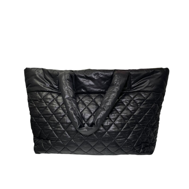 Chanel Cocoon Puff Nylon Tote Black<br />
<br />
Date Code: 2144****<br />
<br />
Dimensions:<br />
Base length: 15 in<br />
Height: 11.5 in<br />
Width: 7 in<br />
Drop: 6.5 in<br />
<br />
In very good condition. Light scratching to the leather. Ripped hole inside front zipper pocket shown in photos.<br />
<br />
Does not come with the original dust bag or box.