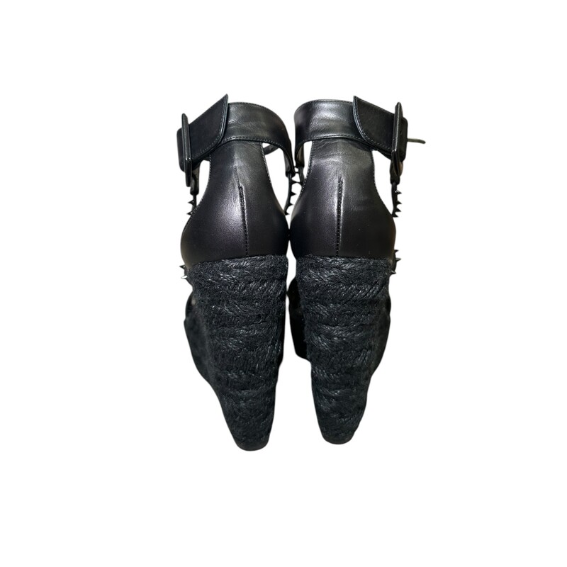 Black Christian Louboutin Chocazeppa  Wedges<br />
<br />
Size 39<br />
<br />
Spikes 120 Espadrilles<br />
<br />
Black Leather<br />
Studded Accents, Jute & Rubber Trim<br />
Multistrap & Buckle Closure at Ankles<br />
<br />
In good condition. Some wear on bottoms and on toe in soles.<br />
<br />
Comes with original dust bags and box.