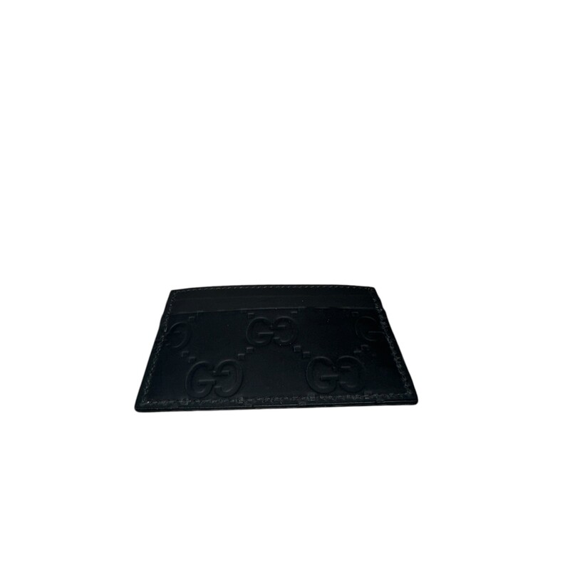 Gucci GG Interlocking Rubber Effect Leather Card Case<br />
<br />
Date Code: 771315.2067<br />
<br />
Dimensions:<br />
Base length: 4 in<br />
<br />
Height: 2.75 in<br />
<br />
In excellent condition.<br />
<br />
Does not come with the original dust bag or box.