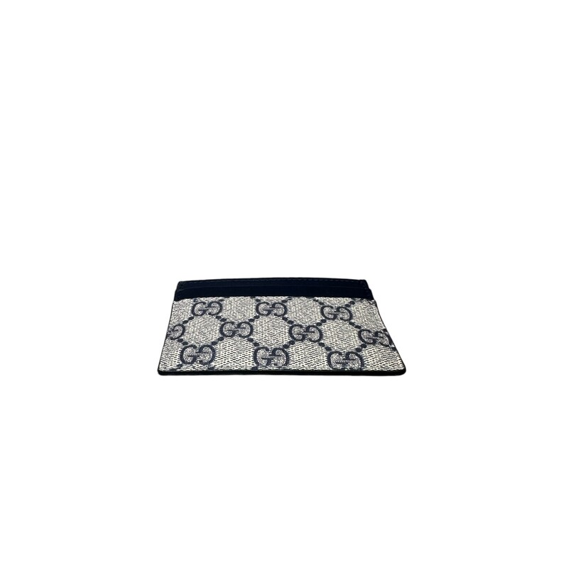 Gucci GG Card Holder  Navy Supreme Wallet<br />
<br />
Date Code:<br />
233166 .525040<br />
<br />
Dimensions:<br />
Base length: 4 in<br />
<br />
Height: 2.75 in<br />
<br />
In excellent condition.<br />
<br />
Does not come with the original dust bag or box.
