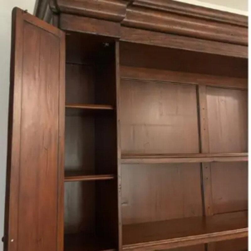 European Italian Inlaid
Brown Solid Wood
Size: 80x21x96H
2 pieces
Italian inlaid bookcase constructed of Eastern European reclaimed hardwood and produced in the Phillipines. This bookcase is beautifully constructed and features three adjustable shelves in the center, flanked with cupboard doors on the right and left that hold four shelves each. There are a total of five compartments that make up the base with each end having three shelves that slide out for easy storage. The finish is hand forged and has that wormy detail that makes this bookcase a showstopper. Made in Phillipines.
Retail $16,500