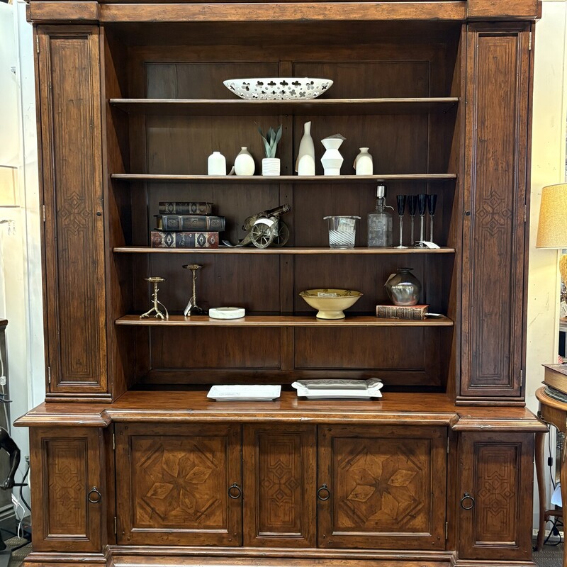 European Italian Inlaid
Brown Solid Wood
Size: 80x21x96H
2 pieces
Italian inlaid bookcase constructed of Eastern European reclaimed hardwood and produced in the Phillipines. This bookcase is beautifully constructed and features three adjustable shelves in the center, flanked with cupboard doors on the right and left that hold four shelves each. There are a total of five compartments that make up the base with each end having three shelves that slide out for easy storage. The finish is hand forged and has that wormy detail that makes this bookcase a showstopper. Made in Phillipines.
Retail $16,500