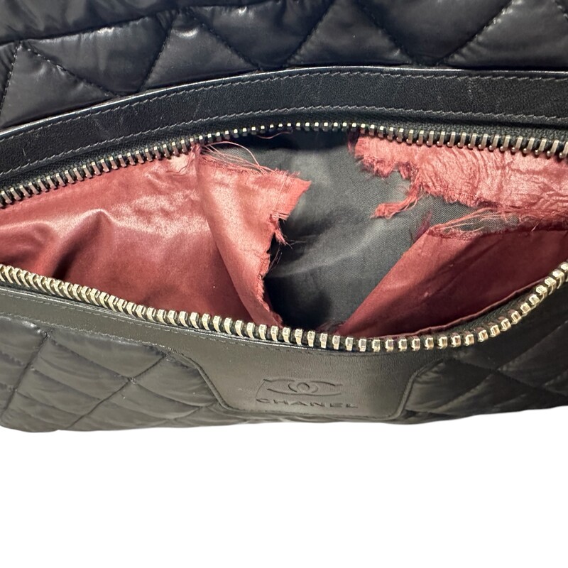Chanel Cocoon Puff Nylon Tote Black<br />
<br />
Date Code: 2144****<br />
<br />
Dimensions:<br />
Base length: 15 in<br />
Height: 11.5 in<br />
Width: 7 in<br />
Drop: 6.5 in<br />
<br />
In very good condition. Light scratching to the leather. Ripped hole inside front zipper pocket shown in photos.<br />
<br />
Does not come with the original dust bag or box.
