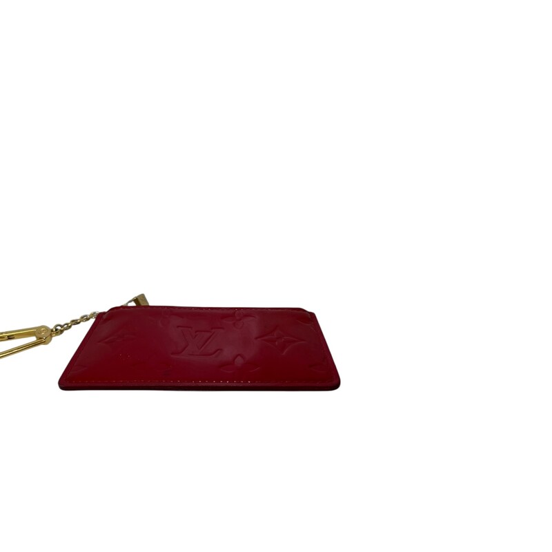 Louis Vuitton Vernis Red  Key Holder<br />
<br />
Date Code: CA1016<br />
<br />
Dimensions: 5 L X 3 H inches<br />
<br />
In very good condition. Some minor scuffs on the patent leather.<br />
<br />
Does not come with original dust bag or box.