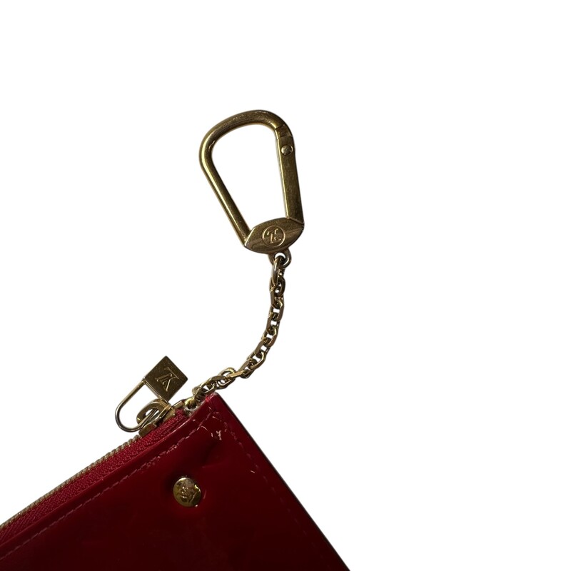 Louis Vuitton Vernis Red  Key Holder<br />
<br />
Date Code: CA1016<br />
<br />
Dimensions: 5 L X 3 H inches<br />
<br />
In very good condition. Some minor scuffs on the patent leather.<br />
<br />
Does not come with original dust bag or box.