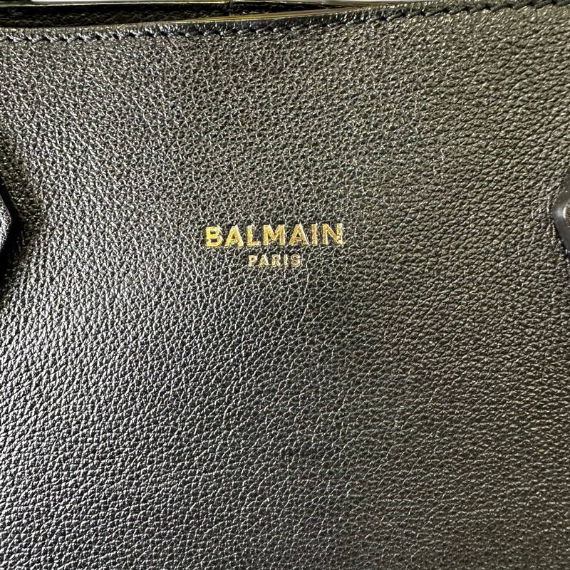 Balmain Black Logo  Leather Tote<br />
<br />
Dimensions: 16 L x 11 H inches<br />
<br />
In good condition. Corner wear and interior stains.<br />
<br />
Does not come with original dust bag or box.