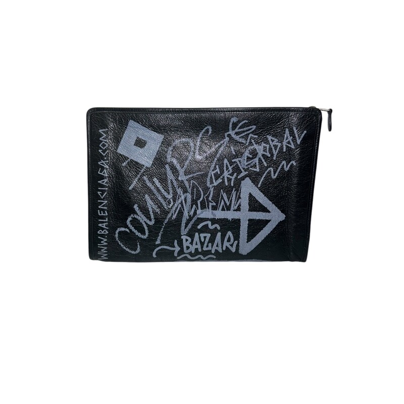 Balenciaga Graffiti Leather Clutch Pouch<br />
<br />
Style code: 443658.1090. Y.535269<br />
<br />
Dimensions: 13 L x 9 H<br />
<br />
In very good condition. Some interior marks and some slight distressing of the leather.<br />
<br />
 Does not come with original dust bag or box.