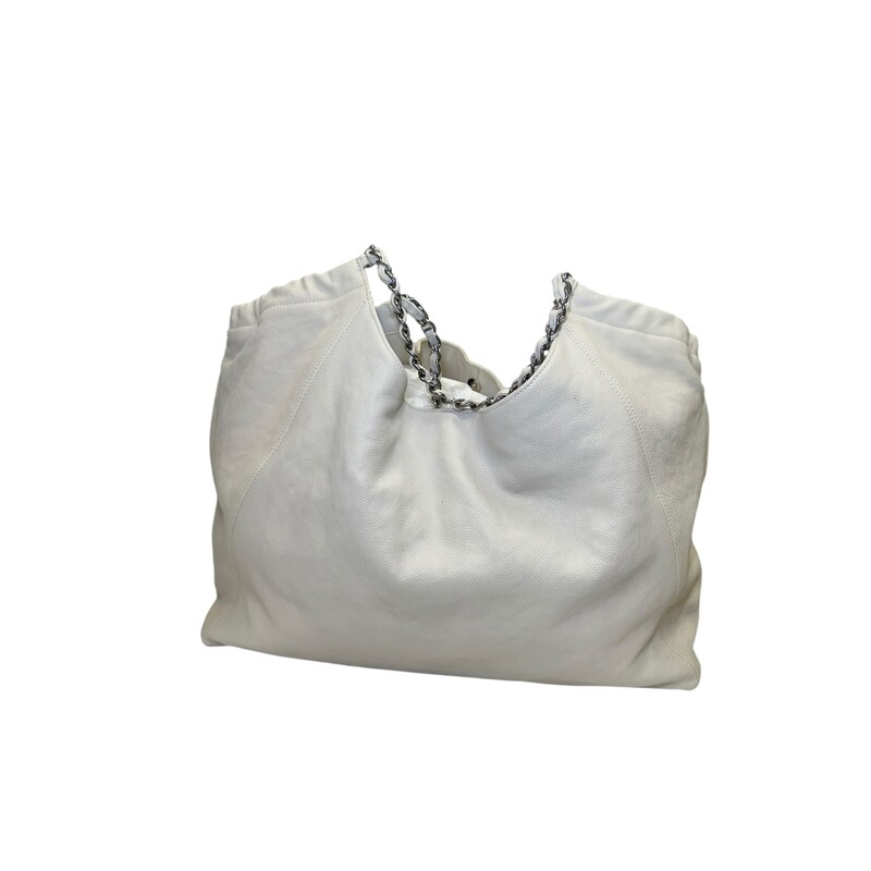 Chanel Coco Cabas Tote White XLarge<br />
<br />
Code: 10895038<br />
<br />
Dimensions:<br />
Length: 23.00 in<br />
Width: 7.50 in<br />
Height: 11.00 in<br />
Drop: 7.00 in<br />
<br />
In very good condition. Slight discoloration throughout the bag. Light interior stains.<br />
<br />
Does not come with the original dust bag or box.