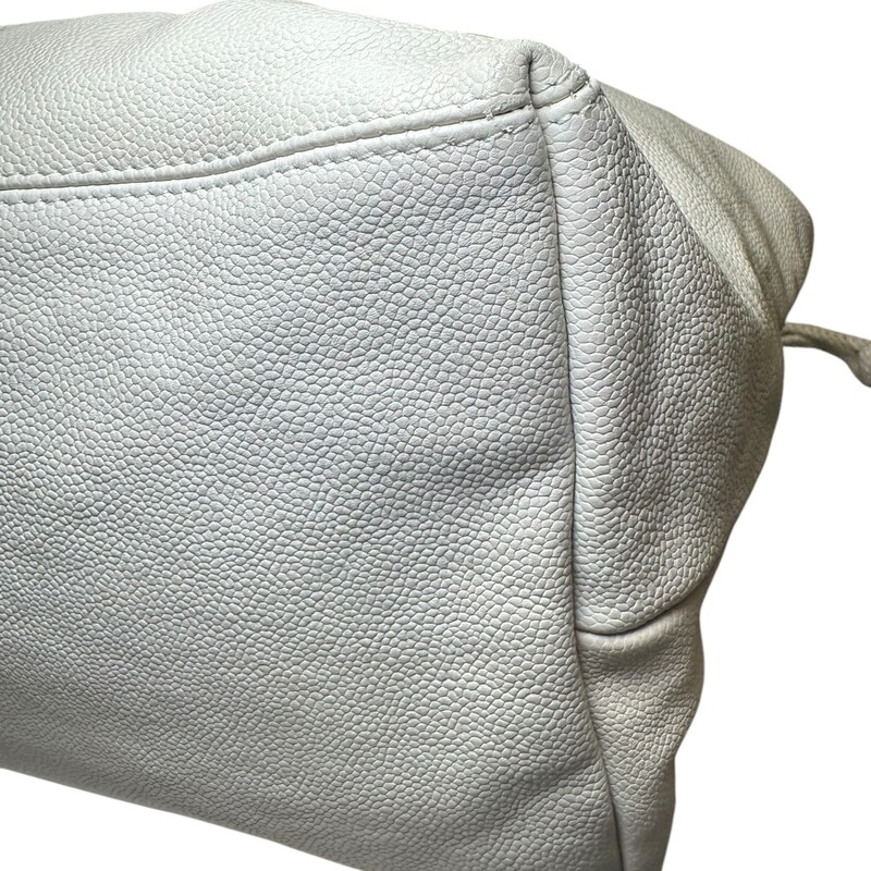 Chanel Coco Cabas Tote White XLarge<br />
<br />
Code: 10895038<br />
<br />
Dimensions:<br />
Length: 23.00 in<br />
Width: 7.50 in<br />
Height: 11.00 in<br />
Drop: 7.00 in<br />
<br />
In very good condition. Slight discoloration throughout the bag. Light interior stains.<br />
<br />
Does not come with the original dust bag or box.