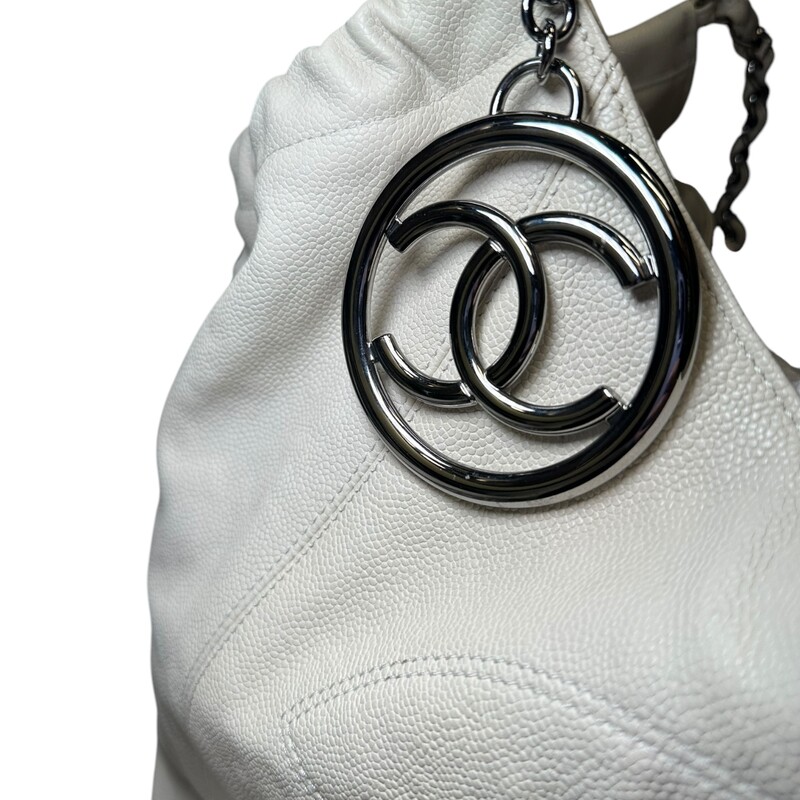 Chanel Coco Cabas Tote White XLarge<br />
<br />
Code: 10895038<br />
<br />
Dimensions:<br />
Length: 23.00 in<br />
Width: 7.50 in<br />
Height: 11.00 in<br />
Drop: 7.00 in<br />
<br />
In very good condition. Slight discoloration throughout the bag. Light interior stains.<br />
<br />
Does not come with the original dust bag or box.