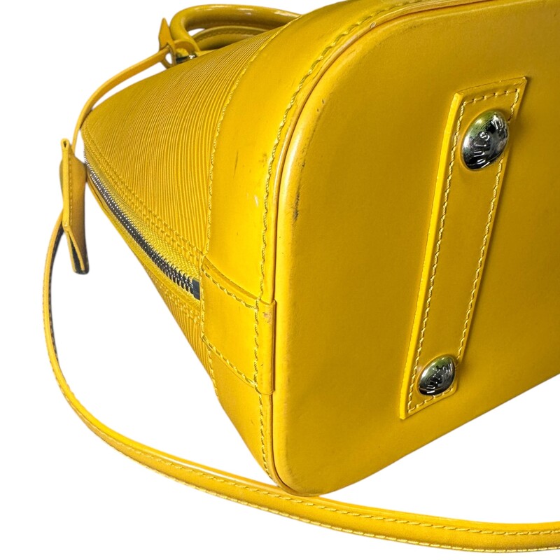 Louis Vuitton Alma Epi Yellow  Leather With long Strap<br />
<br />
Dimensions: 12 L x 9 H inches<br />
<br />
In very good condition. Some scuffs on the base of the bag. Some interior marks.<br />
<br />
Comes with original dust bag. No box.