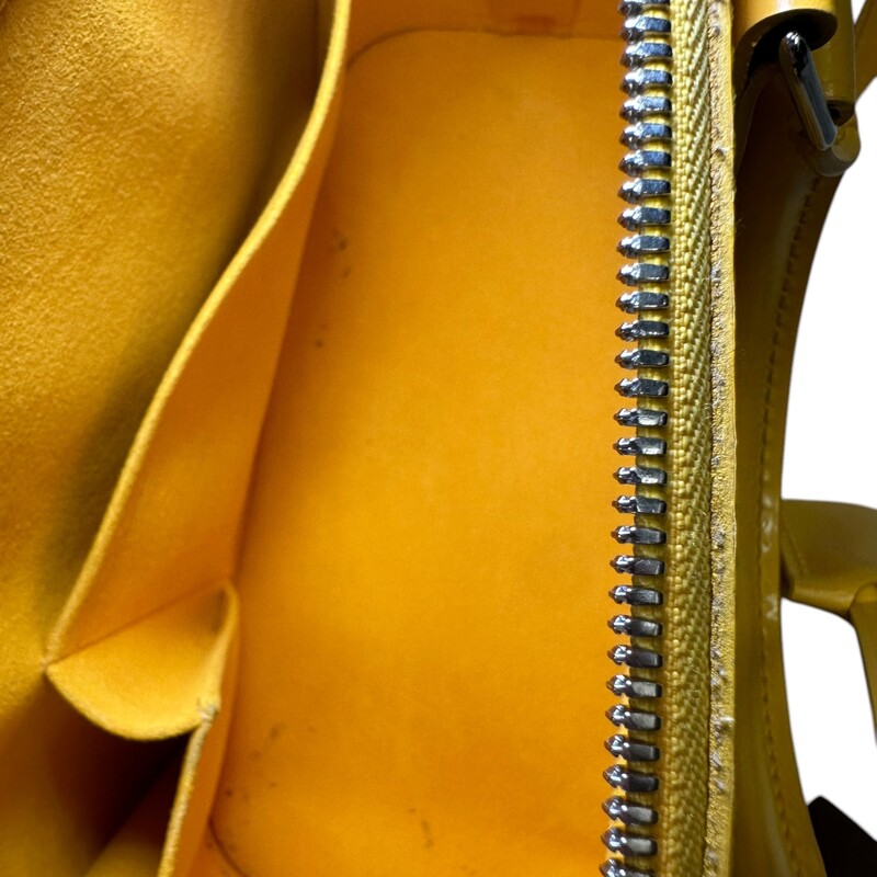 Louis Vuitton Alma Epi Yellow  Leather With long Strap<br />
<br />
Dimensions: 12 L x 9 H inches<br />
<br />
In very good condition. Some scuffs on the base of the bag. Some interior marks.<br />
<br />
Comes with original dust bag. No box.