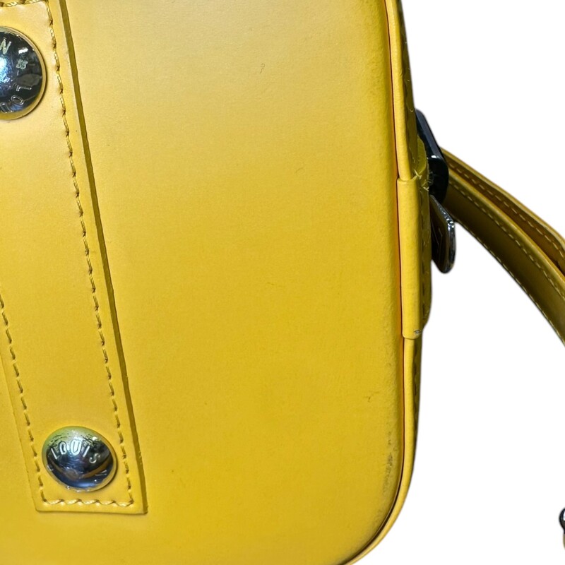 Louis Vuitton Alma Epi Yellow  Leather With long Strap<br />
<br />
Dimensions: 12 L x 9 H inches<br />
<br />
In very good condition. Some scuffs on the base of the bag. Some interior marks.<br />
<br />
Comes with original dust bag. No box.
