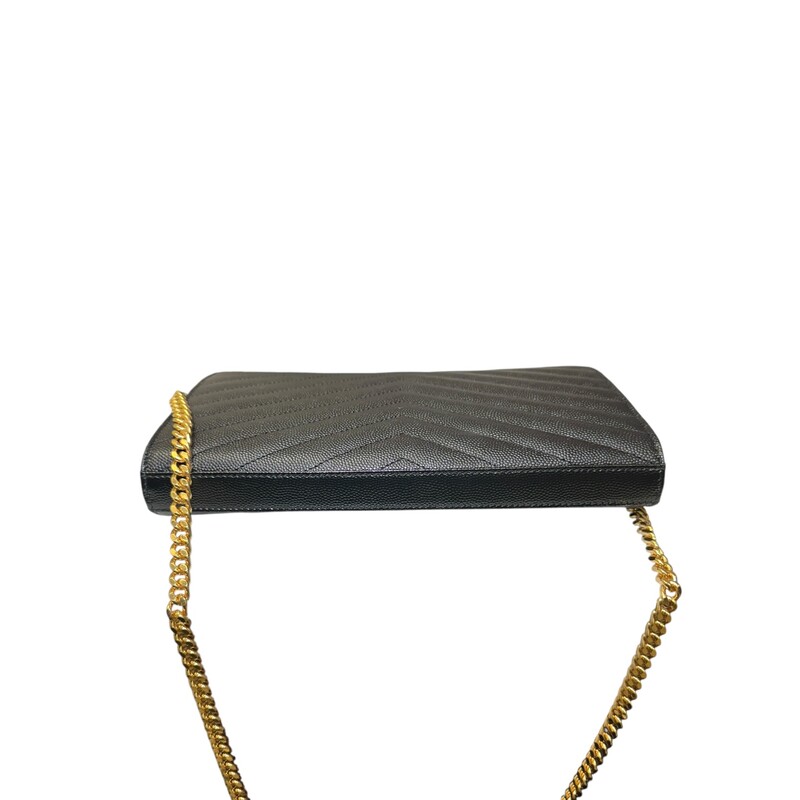 Saint Laurent  Cassandre Grained Wallet On A Chain<br />
<br />
Serial Code: NOV377828.1022<br />
<br />
Dimensions: 5.5H x 9W x 1.5D<br />
<br />
In very good condition. Light hardware scratches.<br />
<br />
Comes with the original dust bag and box.