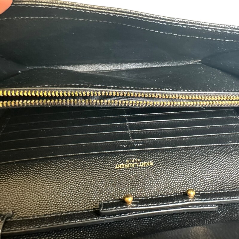 Saint Laurent  Cassandre Grained Wallet On A Chain<br />
<br />
Serial Code: NOV377828.1022<br />
<br />
Dimensions: 5.5H x 9W x 1.5D<br />
<br />
In very good condition. Light hardware scratches.<br />
<br />
Comes with the original dust bag and box.